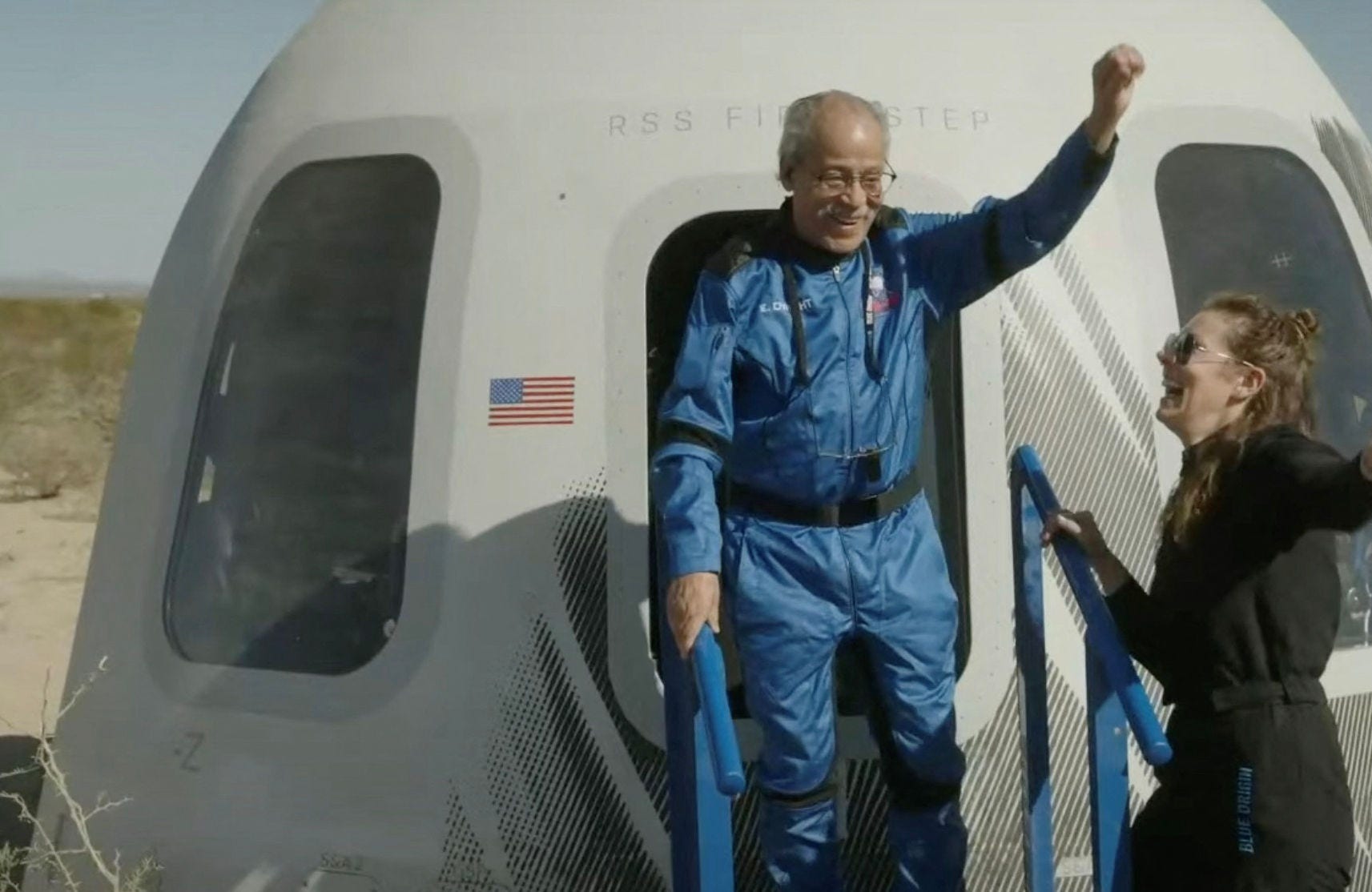 This screen grab taken from a Blue Origin broadcast shows Ed Dwight celebrating as he exits the Mission NS-25 crew capsule, upon landing near the Blue Origin base near Van Horn, Texas, on May 19, 2024. Blue Origin flew adventurers to the final frontier on Sunday for the first time in nearly two years, reigniting competition in the space tourism market after a rocket mishap put its crewed operations on hold. (Photo by HANDOUT / BLUE ORIGIN / AFP) / RESTRICTED TO EDITORIAL USE - MANDATORY CREDIT "AFP PHOTO / BLUE ORIGIN " - NO MARKETING NO ADVERTISING CAMPAIGNS - DISTRIBUTED AS A SERVICE TO CLIENTS