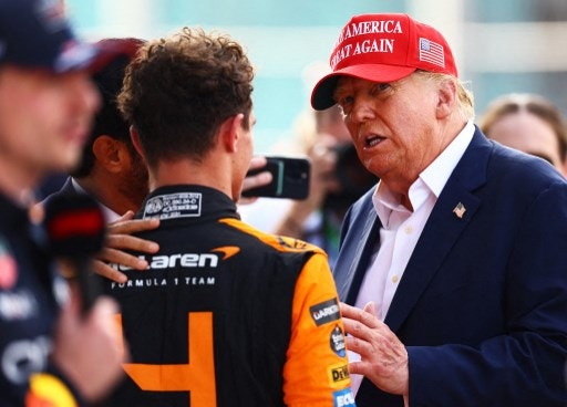 MIAMI, FLORIDA - MAY 05: Donald Trump talks with Race winner Lando Norris of Great Britain and McLaren in parc ferme during the F1 Grand Prix of Miami at Miami International Autodrome on May 05, 2024 in Miami, Florida.   Mark Thompson/Getty Images/AFP (Photo by Mark Thompson / GETTY IMAGES NORTH AMERICA / Getty Images via AFP)