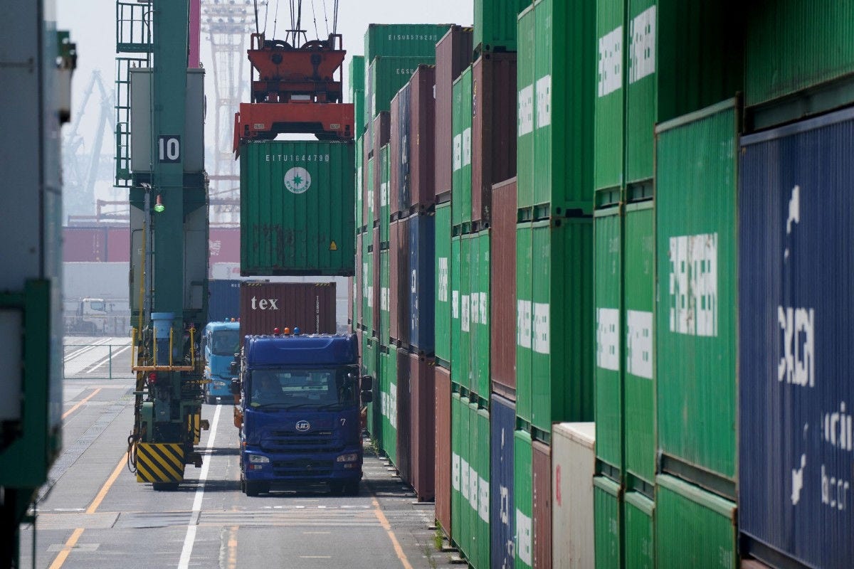 A container is loaded onto a truck at the international cargo terminal at the port of Tokyo on July 8, 2025. (Photo by Kazuhiro NOGI / AFP)