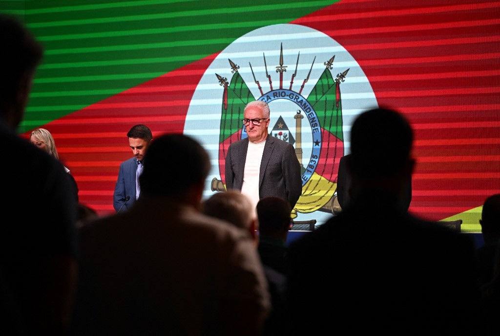Brazil's national football team head coach, Dorival Junior, pays tribute to Rio Grande do Sul victims during a press conference in Rio de Janeiro, Brazil on May 10, 2024. Dorival Junior named the squad that will participate in the upcoming Copa America in US. (Photo by MAURO PIMENTEL / AFP)