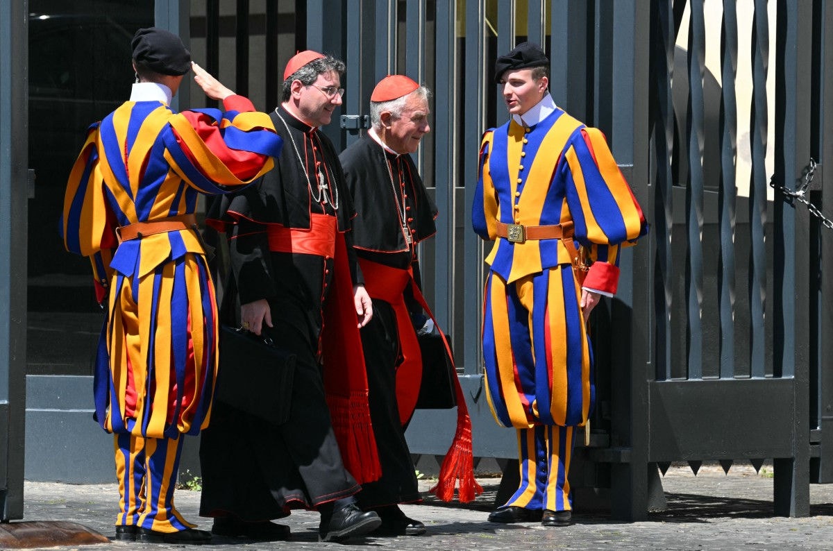Archbishop of Toronto, cardinal Frank Leo (L) and Cardinal John Atcherley Dew from New Zealand leave the general congregation meeting at The Vatican, on April 29, 2025. (Photo by Andreas SOLARO / AFP)