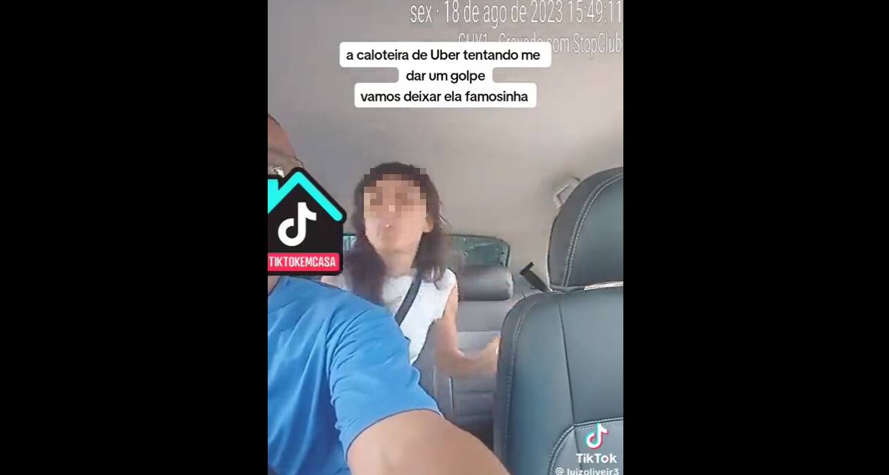 Frame de vídeo em que mulher cospe em motorista de aplicativo