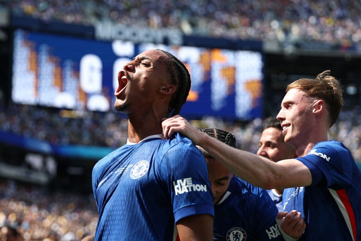 Chelsea's Brazilian forward #20 Joao Pedro (L) celebrates scoring his team's third goal with Chelsea's English midfielder #10 Cole Palmer during the FIFA Club World Cup 2025 final football match between England's Chelsea and France's Paris Saint-Germain at the MetLife Stadium in East Rutherford, New Jersey on July 13, 2025. (Photo by FRANCK FIFE / AFP)