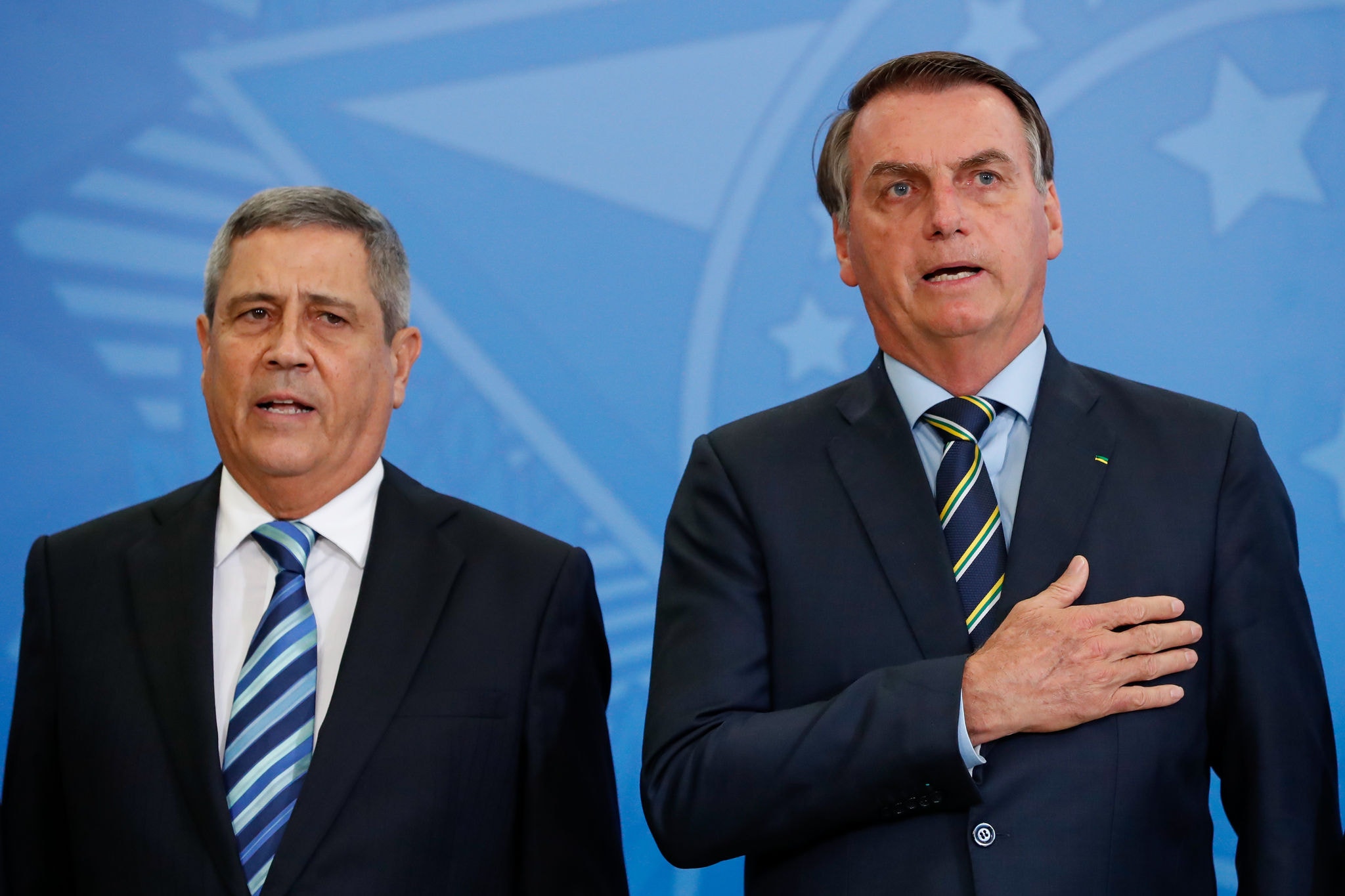O ex-presidente Jair Bolsonaro (PL) e o general Walter Braga Netto (PL)  durante evento no Palácio do Planalto.