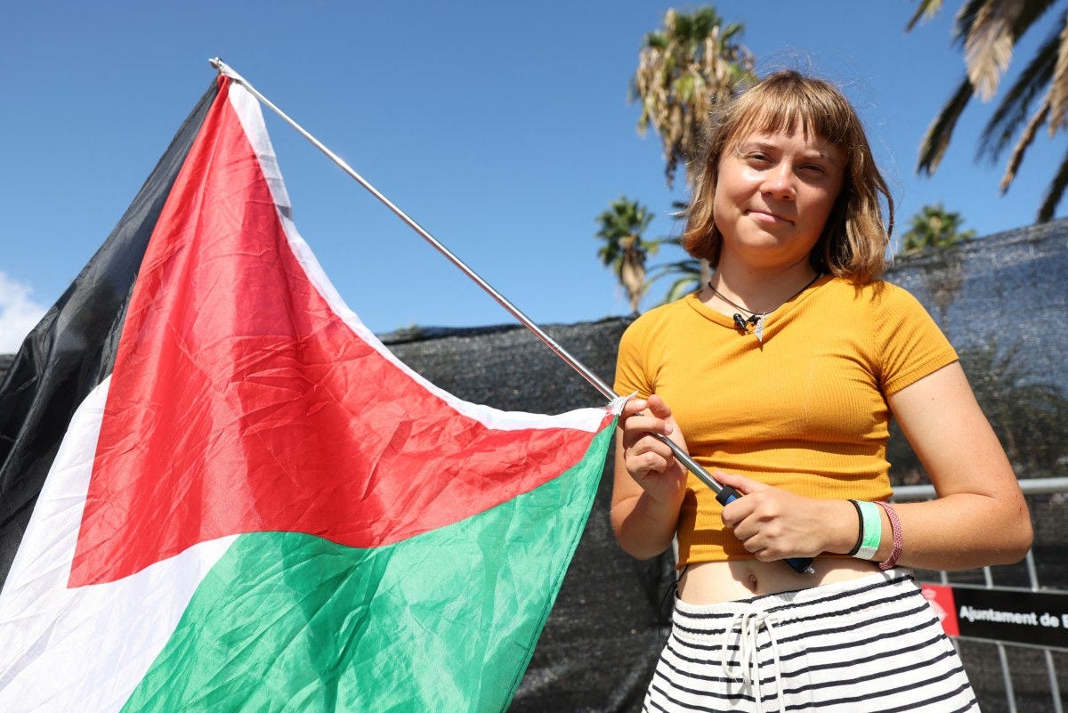Swedish climate activist Greta Thunberg poses with a Palestinian flag as a flotilla carrying humanitarian aid and activists prepare to leave for Gaza, in Barcelona on August 30, 2025. A flotilla carrying humanitarian aid and activists, including Swedish climate campaigner Greta Thunberg, is set to depart Barcelona on August 31 to try to "break the illegal siege of Gaza," organizers said. (Photo by LLUIS GENE / AFP)