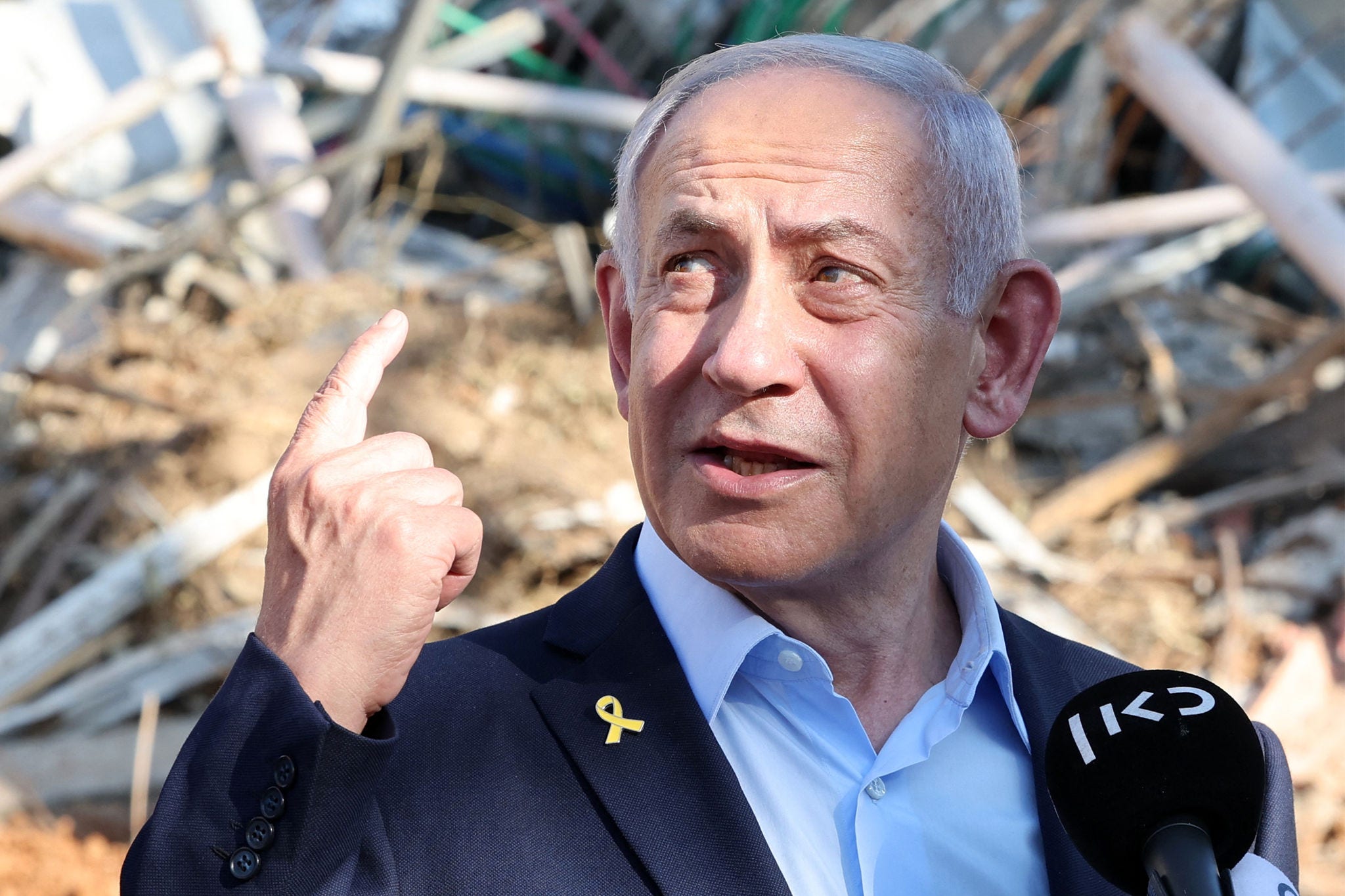 Israel's Prime Minister Benjamin Netanyahu gives a statement during a visit to the site of the Weizmann Institute of Science, which was hit by an Iranian missile barrage, in the central city of Rehovot on June 20, 2025. (Photo by Jack GUEZ / POOL / AFP)