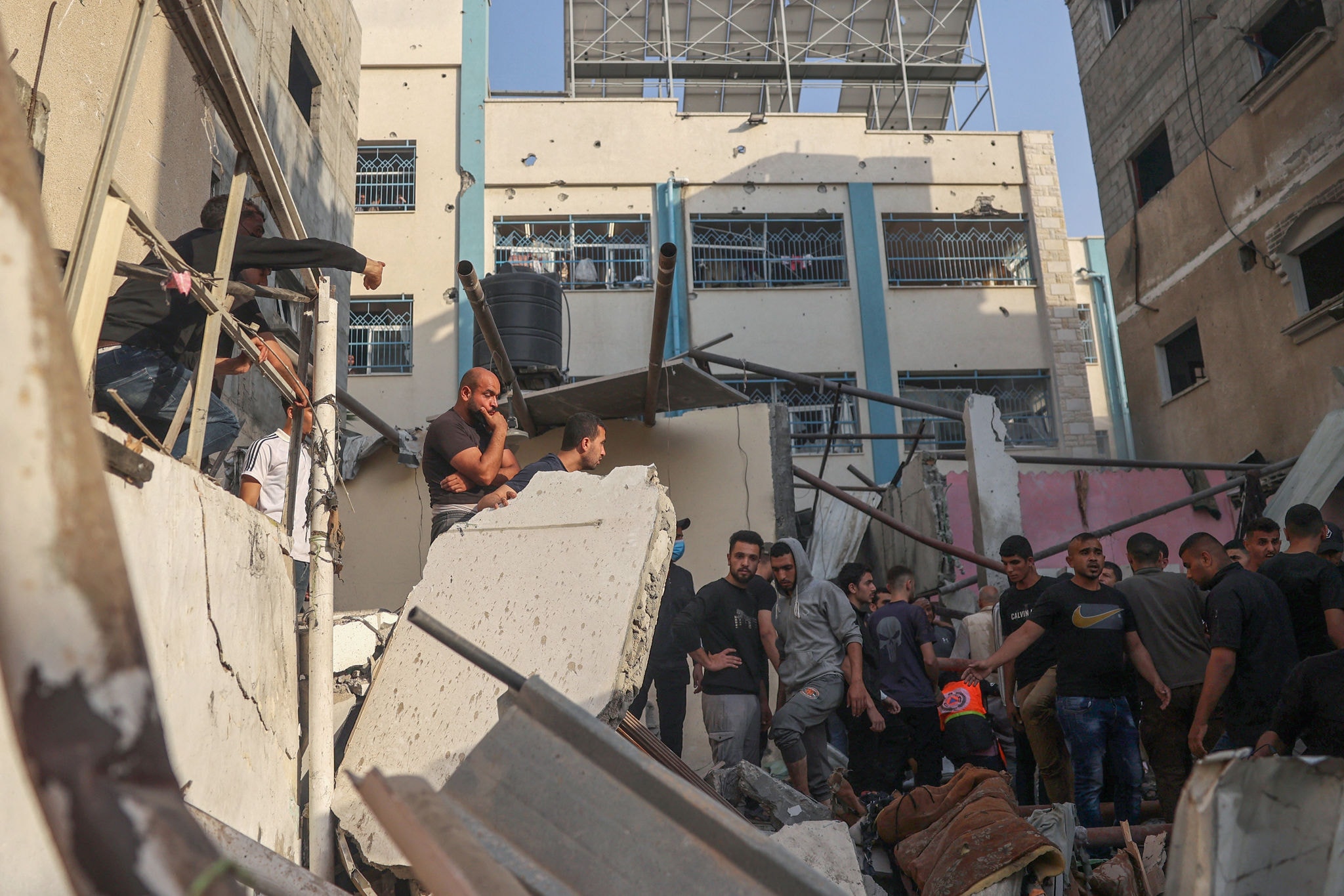 Palestinians search for casualties in the rubble of a house destroyed in an Israeli strike in the center of Rafah in the southern Gaza Strip on May 5, 2024, amid the ongoing conflict between Israel and the Palestinian Hamas movement. (Photo by AFP)