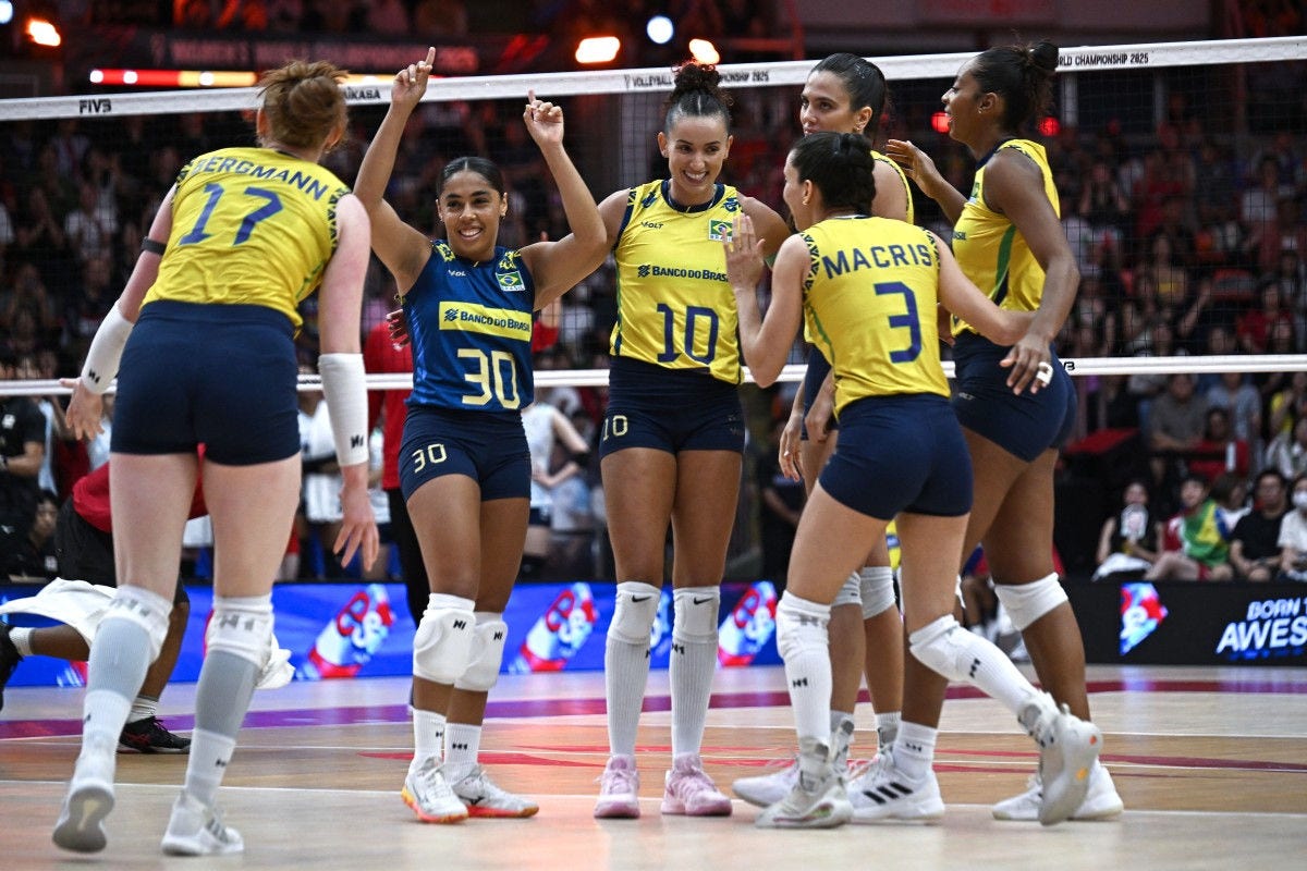 Team Brazil celebrate winning a point against Japan during the bronze medal match of the 2025 Women's Volleyball World Championships in Bangkok on September 7, 2025. (Photo by Amaury PAUL / AFP)