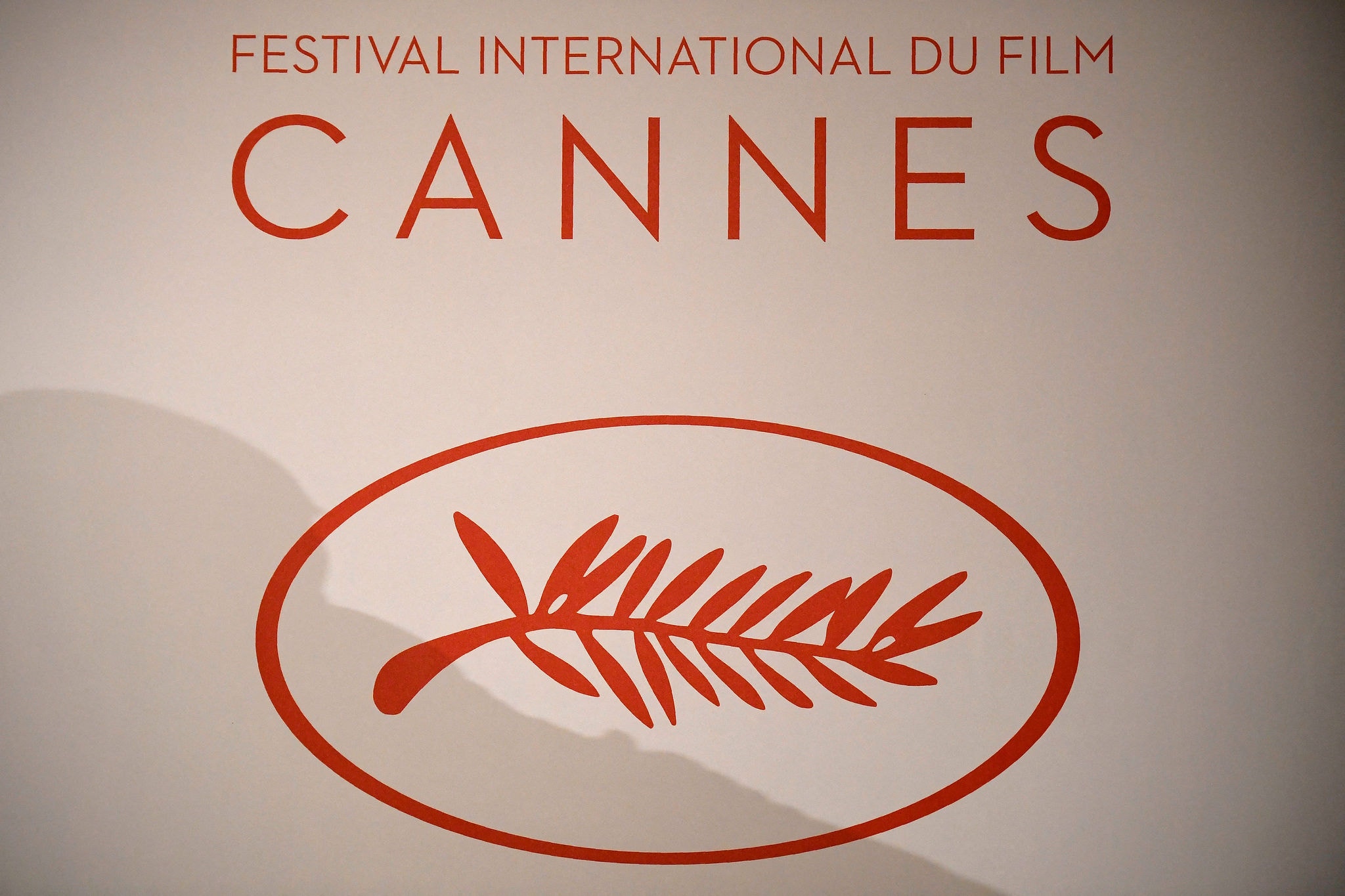 (FILES) The logo of the International Cannes Film Festival is pictured during a press conference to announce the movies in official competition for the upcoming 70th International Cannes film festival, in Paris, on April 13, 2017. A collective of cinema workers haved called for strike on May 6, 2024, one week before the opening of the 77th edition of the Cannes Film Festival. (Photo by Lionel BONAVENTURE / AFP)