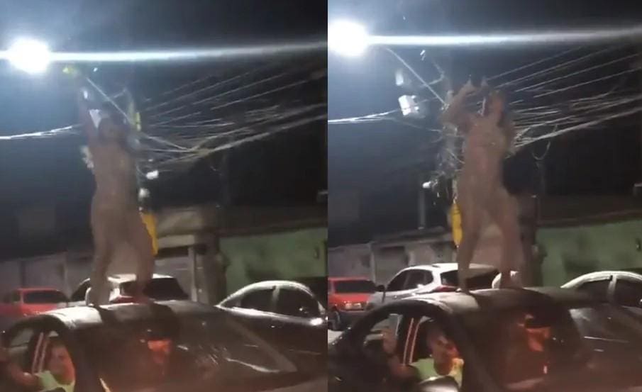 Sobre carro, mulher usa o vestido transparente que fez seu primeiro vídeo viralizar