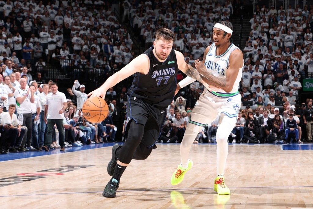 MINNEAPOLIS, MN - MAY 22: Luka Doncic #77 of the Dallas Mavericks drives to the basket during the game against the Minnesota Timberwolves during Game 2 of the Western Conference Finals of the 2024 NBA Playoffs on May 22, 2024 at Target Center in Minneapolis, Minnesota. NOTE TO USER: User expressly acknowledges and agrees that, by downloading and or using this Photograph, user is consenting to the terms and conditions of the Getty Images License Agreement. Mandatory Copyright Notice: Copyright 2024 NBAE   David Sherman/NBAE via Getty Images/AFP (Photo by David Sherman / NBAE / Getty Images / Getty Images via AFP)