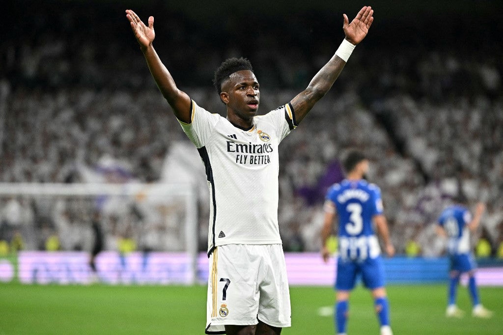 Real Madrid's Brazilian forward #07 Vinicius Junior celebrates after scoring his team's second goal during the Spanish league football match between Real Madrid CF and Deportivo Alaves at the Santiago Bernabeu stadium in Madrid on May 14, 2024. (Photo by JAVIER SORIANO / AFP)