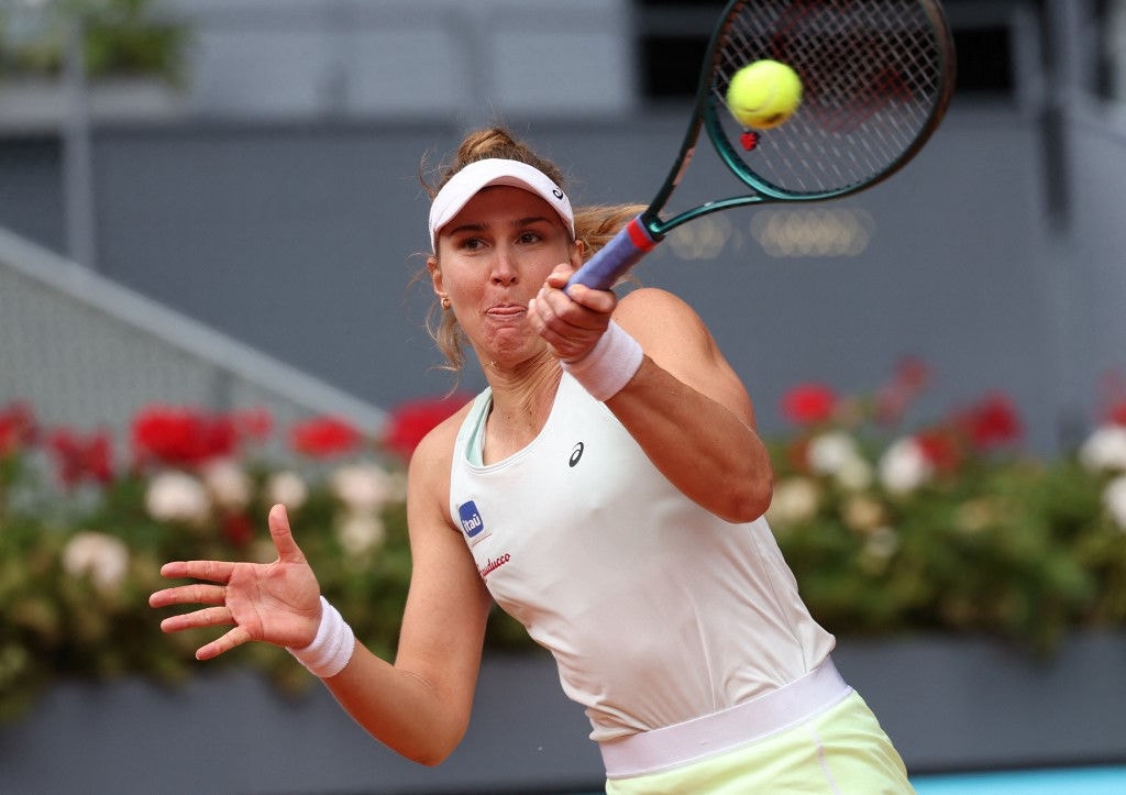 Brazil's Beatriz Haddad Maia returns the ball to Poland's Iga Swiatek during the 2024 WTA Tour Madrid Open tournament quarter-finals tennis match at Caja Magica in Madrid on April 30, 2024. (Photo by PIERRE-PHILIPPE MARCOU / AFP)