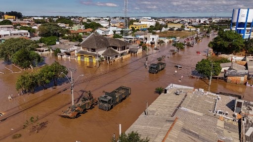 Aerial view of floods in Eldorado do Sul, Rio Grande do Sul state, Brazil, taken on May 9, 2024. Teams raced against the clock Thursday to deliver aid to flood-stricken communities in southern Brazil before the arrival of new storms forecast to batter the region again. Some 400 municipalities have been affected by the worst natural calamity ever to hit the state of Rio Grande do Sul, with at least 107 people dead and hundreds injured.Teams raced against the clock Thursday to deliver aid to flood-stricken communities in southern Brazil before the arrival of new storms forecast to batter the region again. Some 400 municipalities have been affected by the worst natural calamity ever to hit the state of Rio Grande do Sul, with at least 107 people dead and hundreds injured. (Photo by Carlos FABAL / AFP)