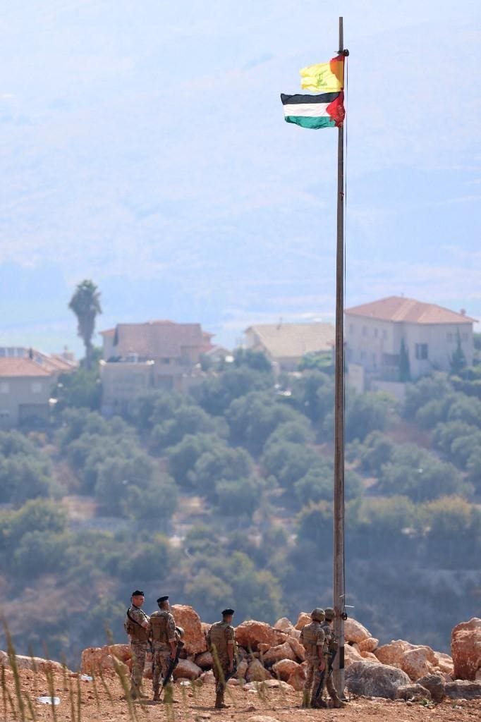 Bandeiras da Palestina e Hezbollah