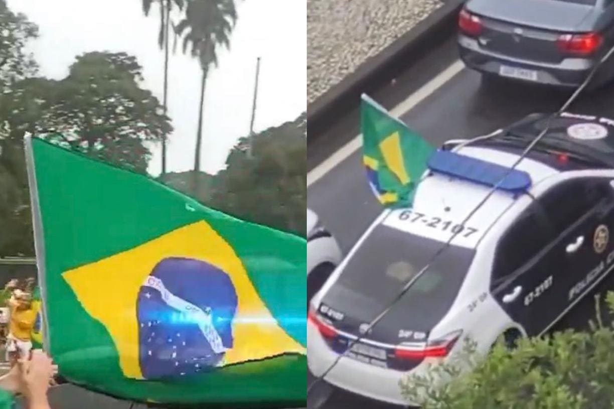 Policiais Civis erguem bandeira do Brasil em viatura durante manifestações